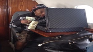 15-on-his-private-jet-with-a-briefcase-full-of-money